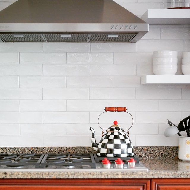 Close-up of a white glossy subway tile backsplash