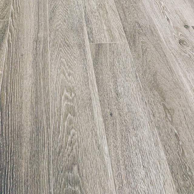 Close-up of a gray wood-look plank floor